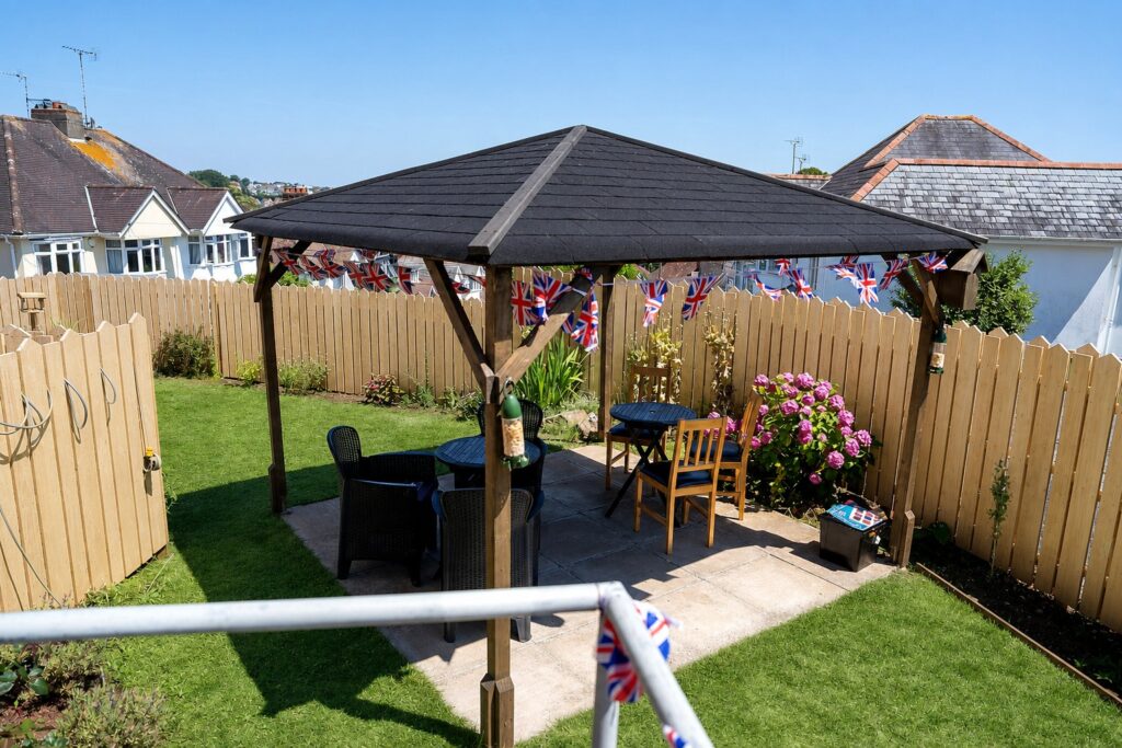 Relaxed pergola seating in Kingsmount's garden