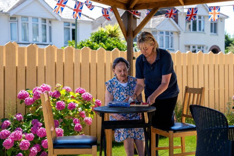 Staff and residents together outdoors at Kingsmount