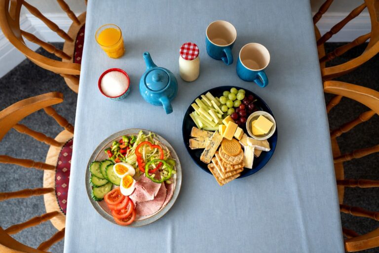 Lunch plates and a cheese board, viewed from above