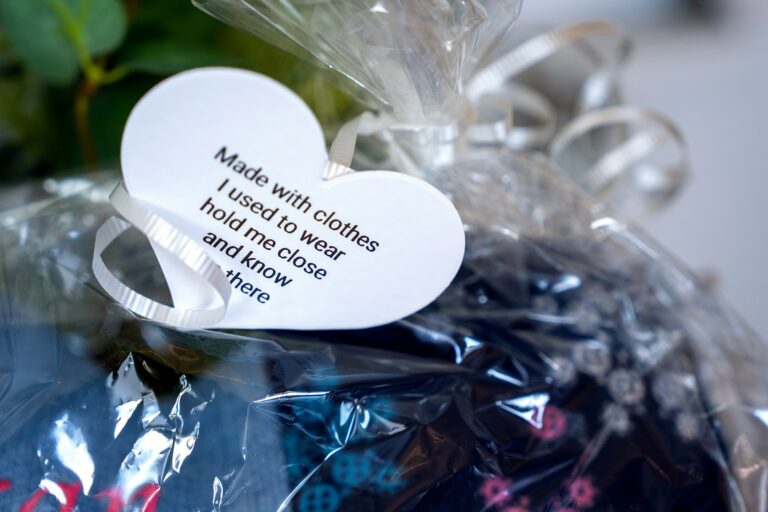 A keepsake tag reading 'Made with clothes I used to wear, hold me close and know I'm always there'